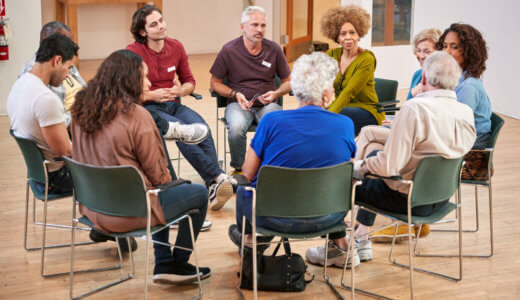 Group of people seated in a circle